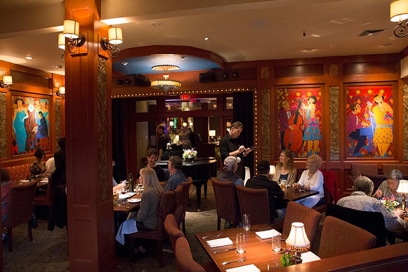 Hearsay dining room features bold paintings, comfortable seating, excellent service and food